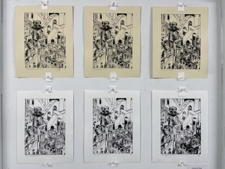Six etching prints pinned to a wall