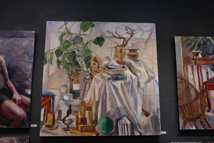 Still life painting hung in a gallery