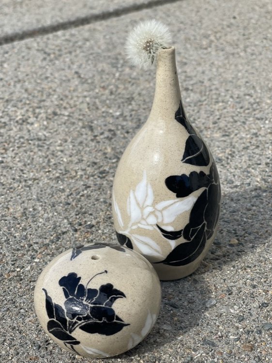 Ceramic vases with a dandelion