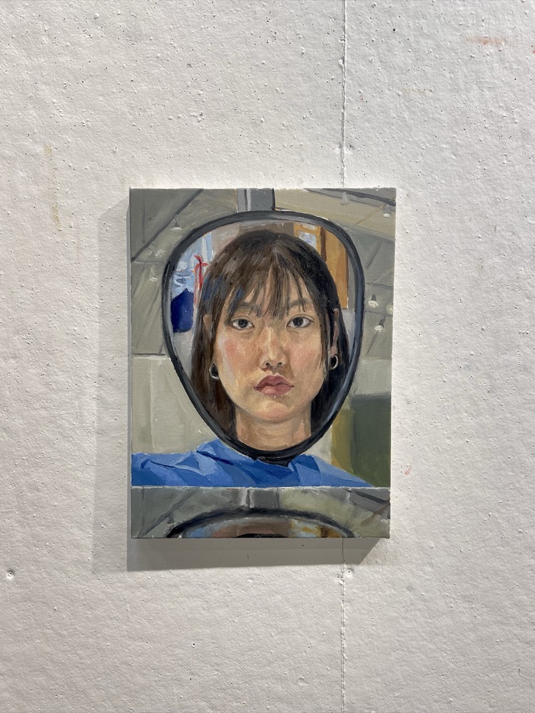 Painting of a self portrait in a mirror